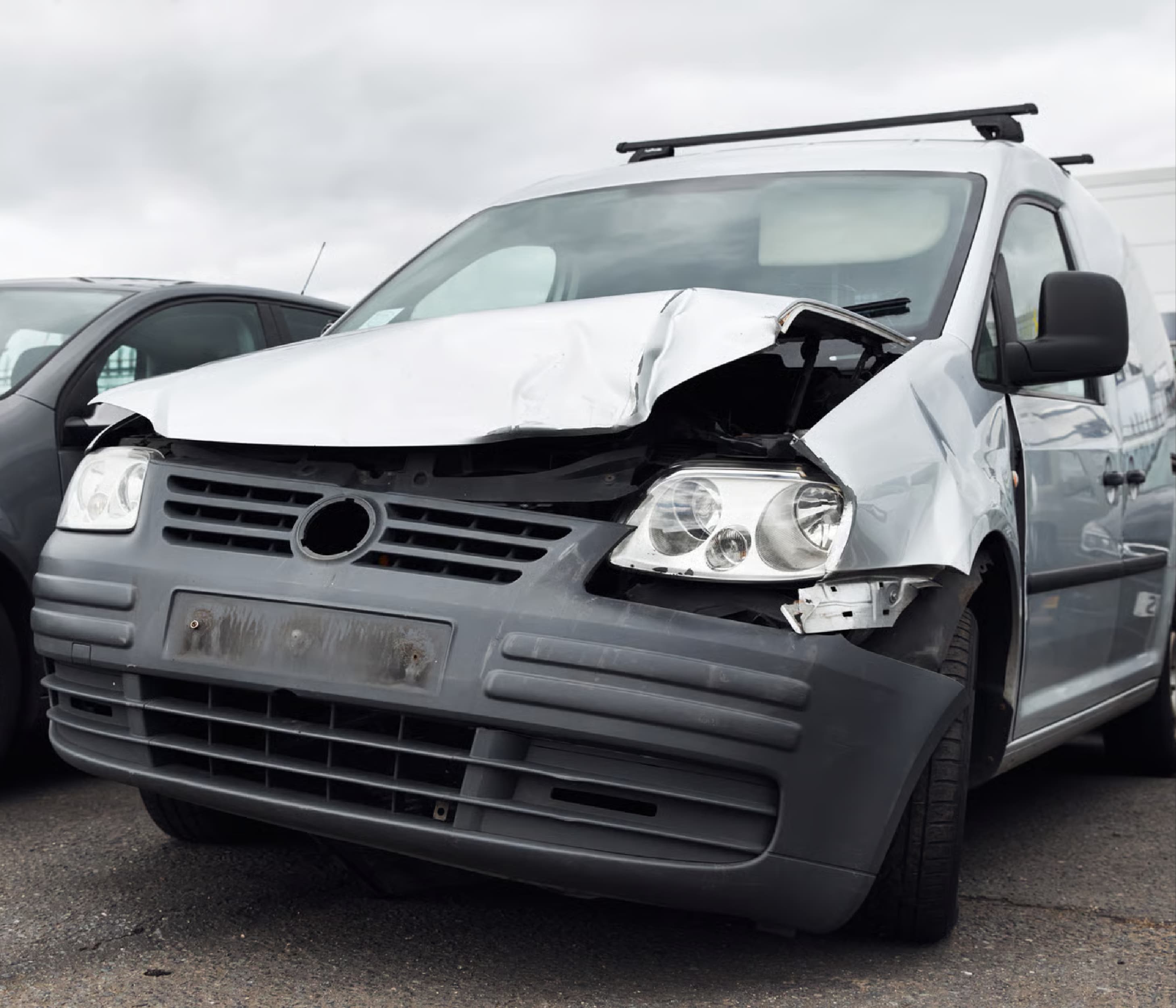 White van with front-end collision damage